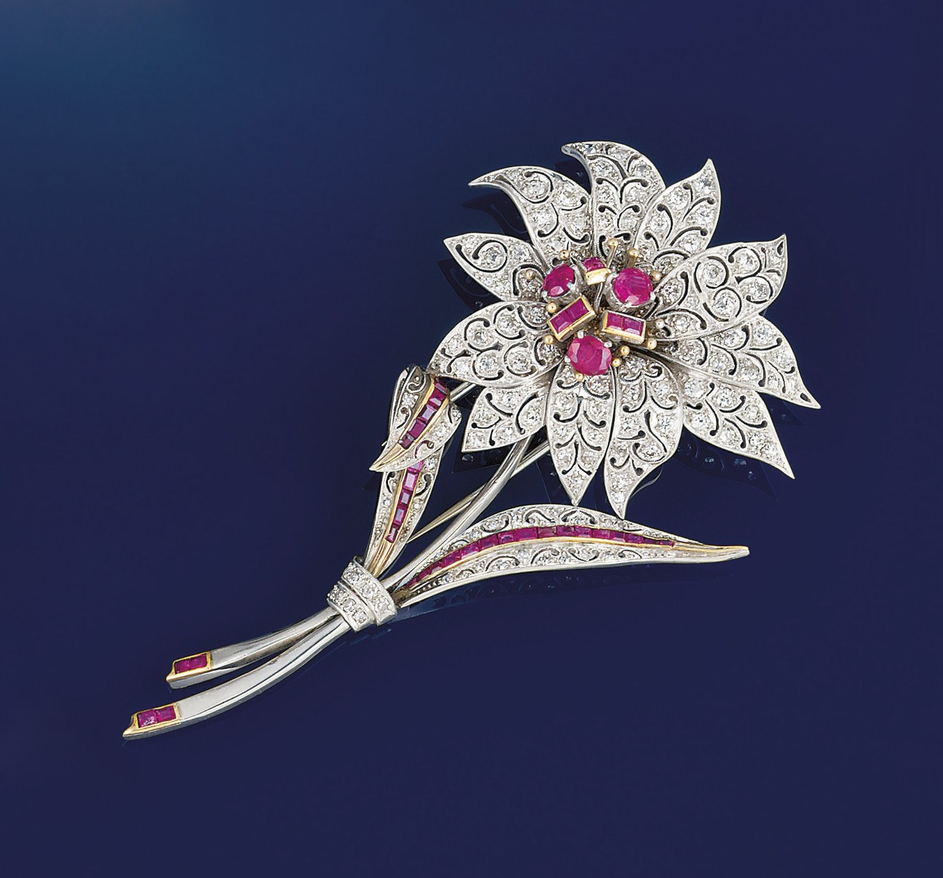 A ruby and diamond flower brooch