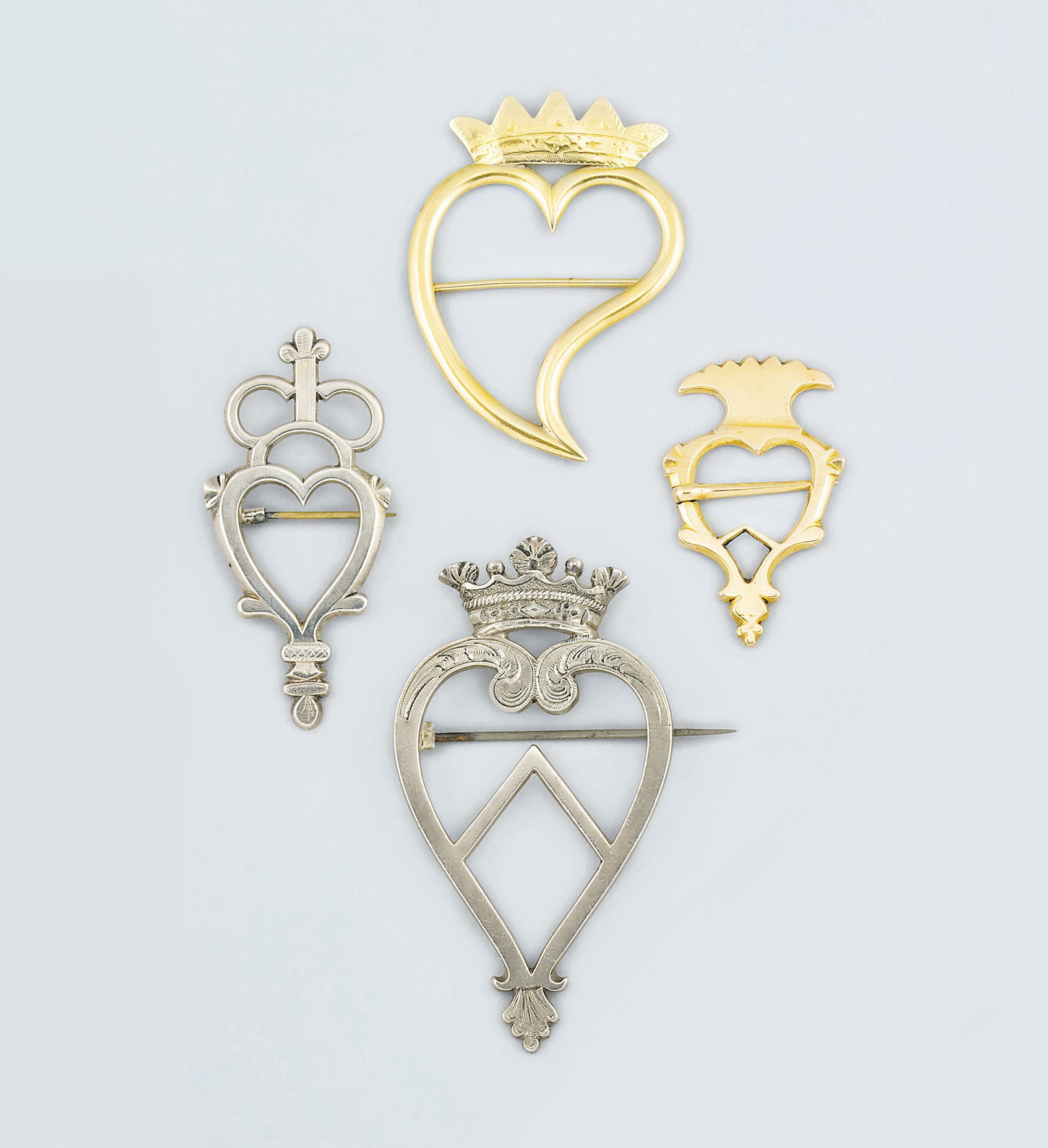 A group of four 'Luckenbooth' brooches