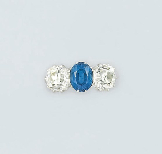 A sapphire and diamond three stone ring