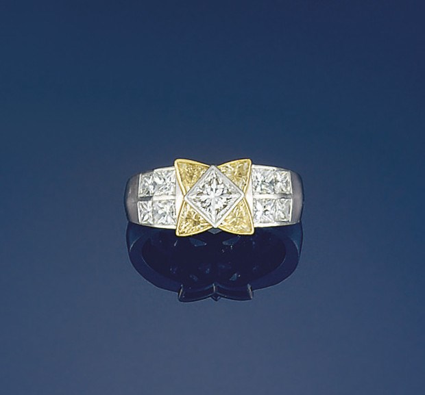 A platinum, diamond and coloured diamond ring, by Boodle & Dunthorne