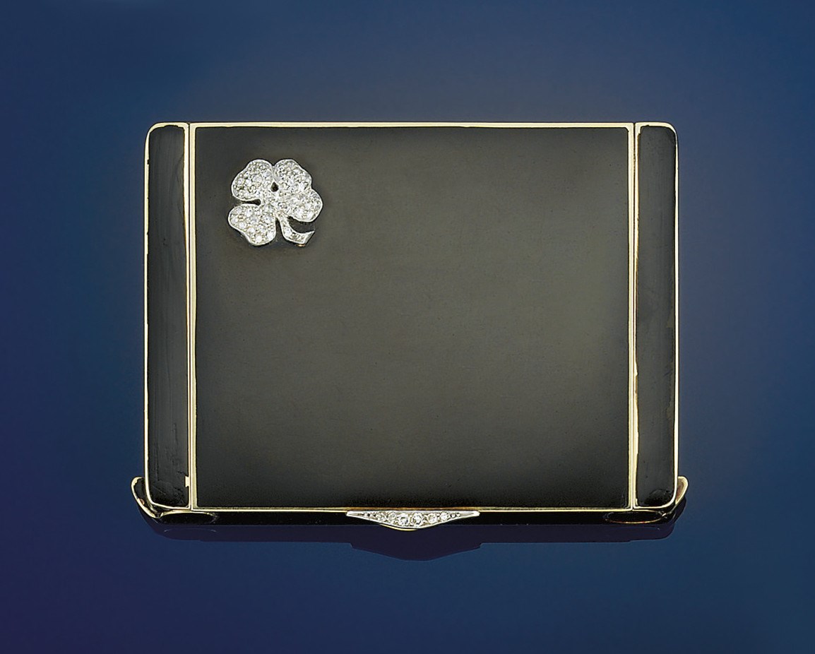 An art deco gold, diamond and enamel compact