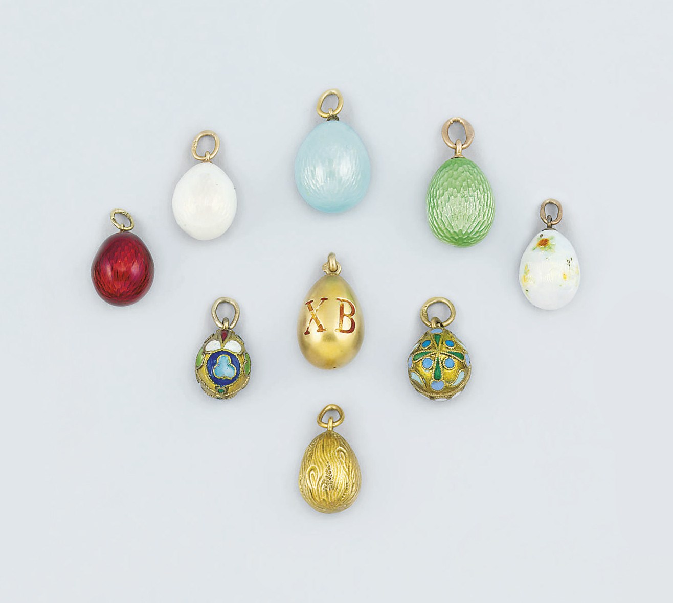 A collection of twenty-four Russian miniature egg pendants