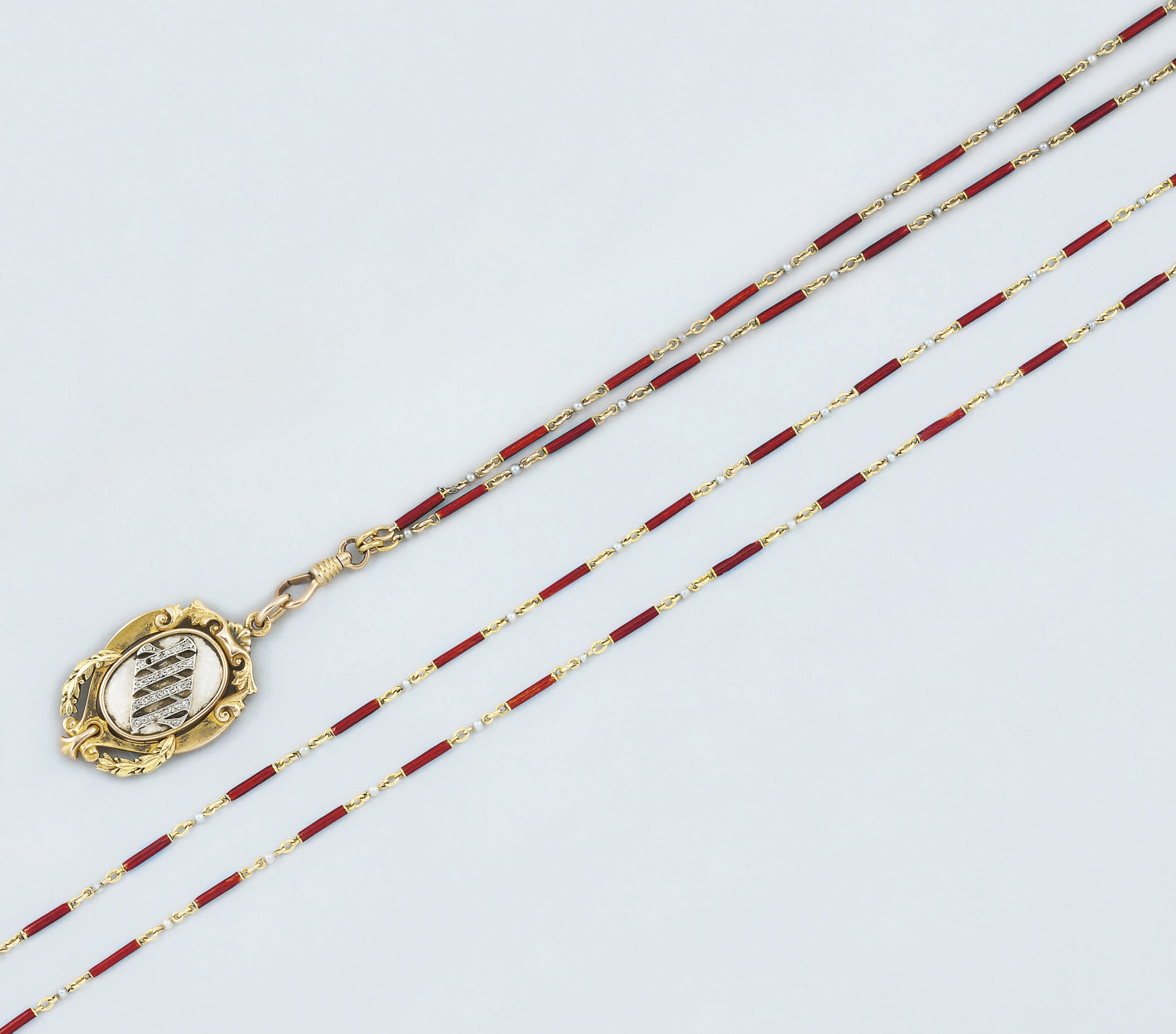 An early 20th century gold, diamond and enamel fob/pendant and neckchain