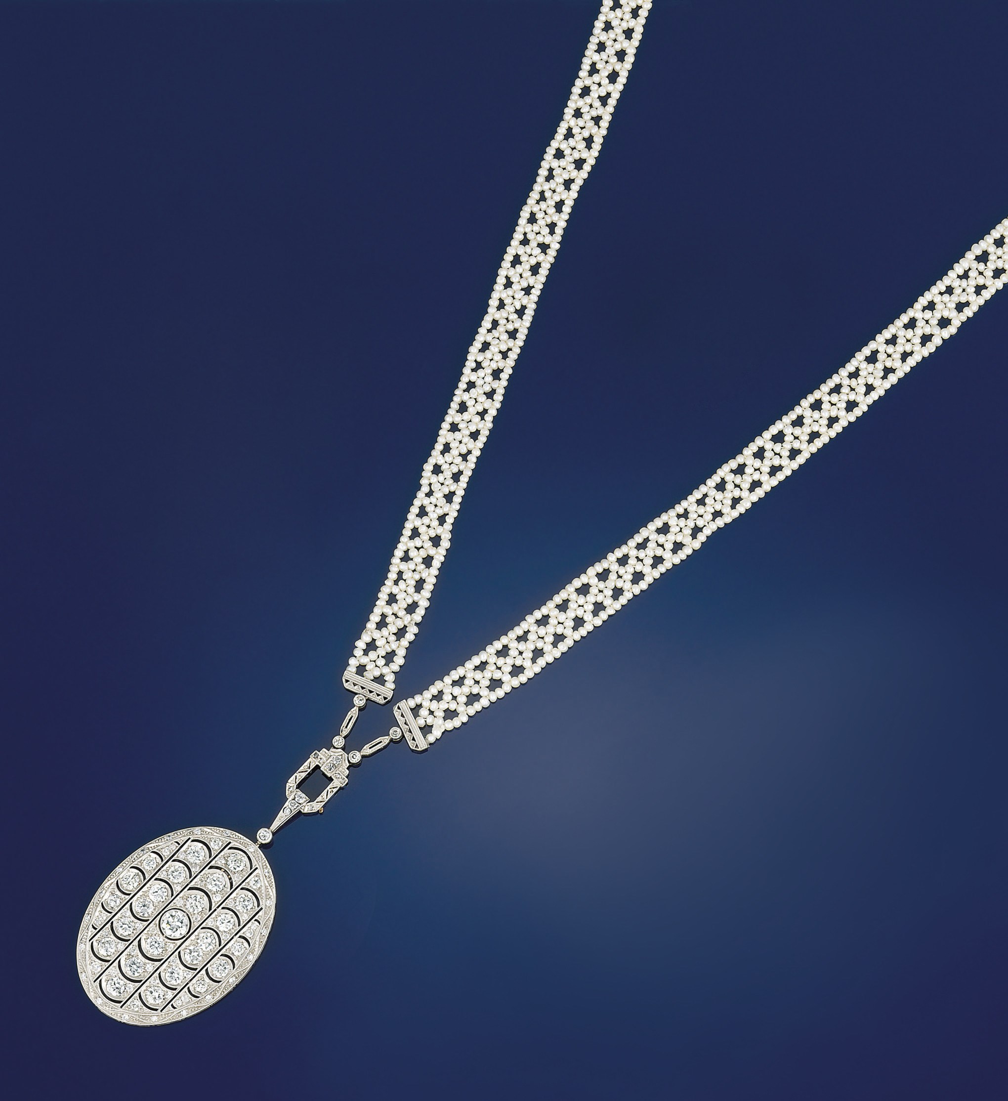 An early 20th century seed pearl and diamond sautoir
