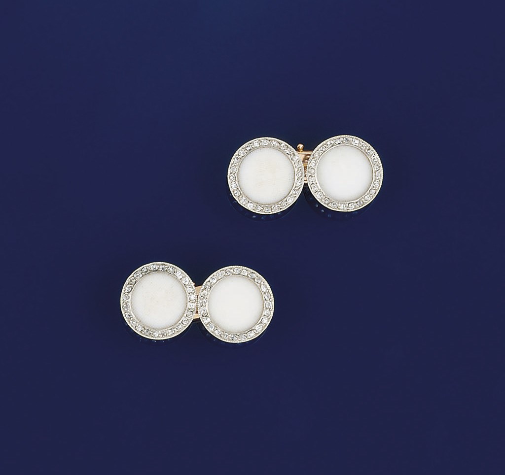 A pair of coral and diamond set cufflinks