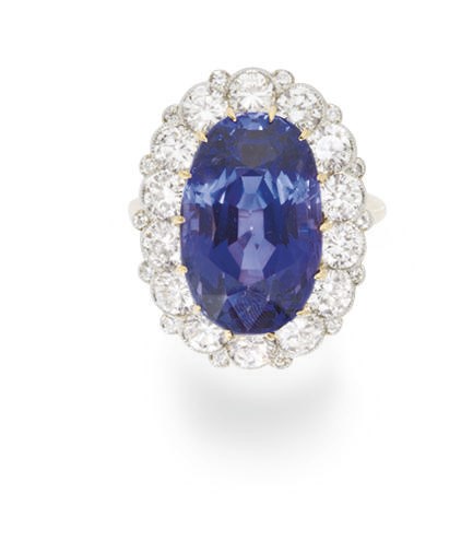 A COLOR-CHANGE SAPPHIRE AND DIAMOND RING