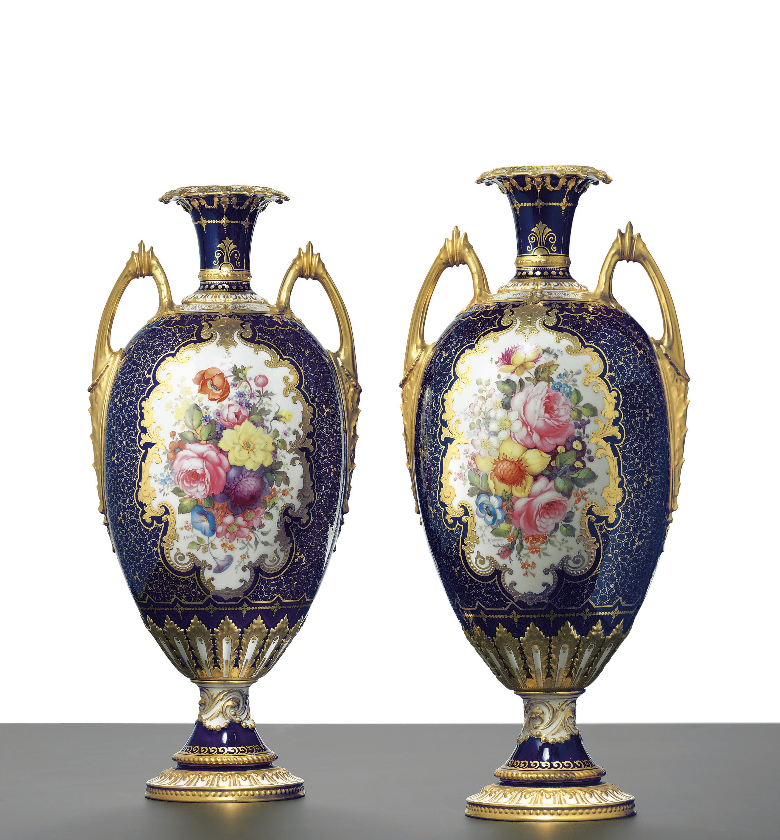 A PAIR OF ROYAL CROWN DERBY COBALT BLUE-GROUND VASES