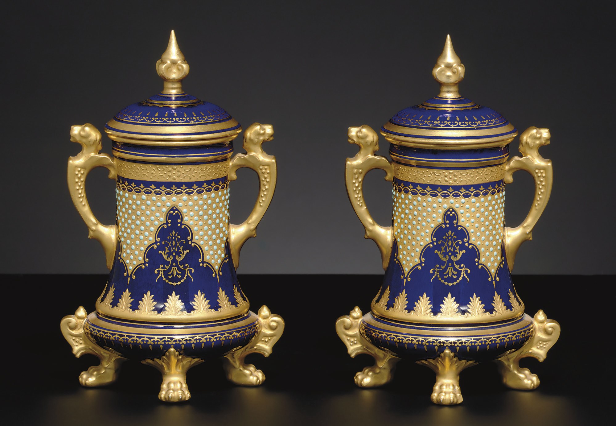 A PAIR OF COALPORT COBALT-BLUE AND GOLD GROUND 'JEWELED' VASES AND COVERS
