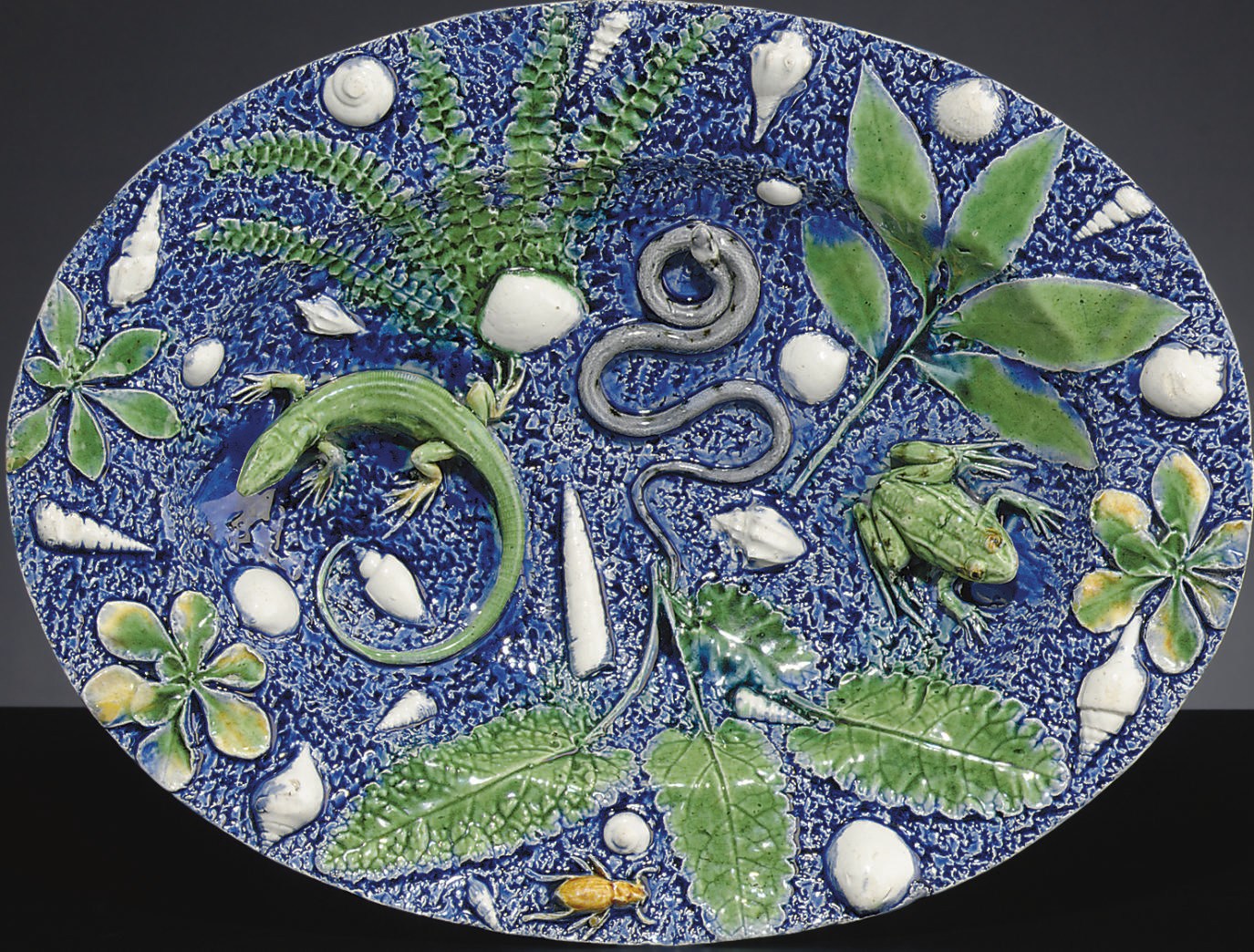 A FRENCH PALISSY STYLE TROMPE L'OEIL FOOTED DISH