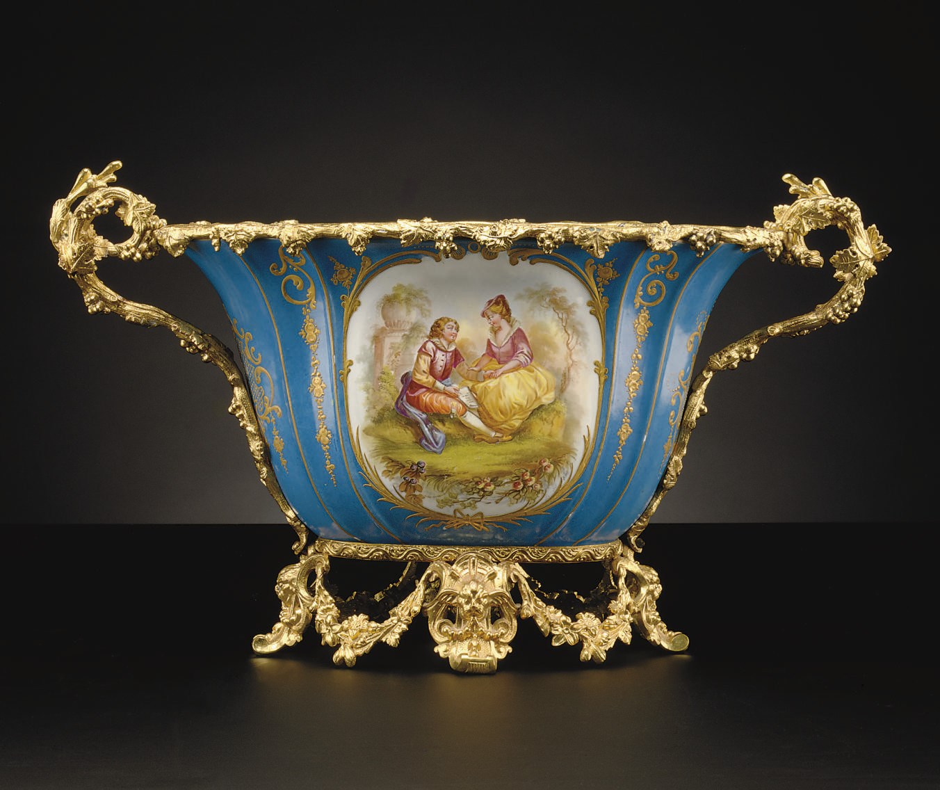 AN ORMOLU-MOUNTED SEVRES STYLE TURQUOISE-GROUND CENTERPIECE