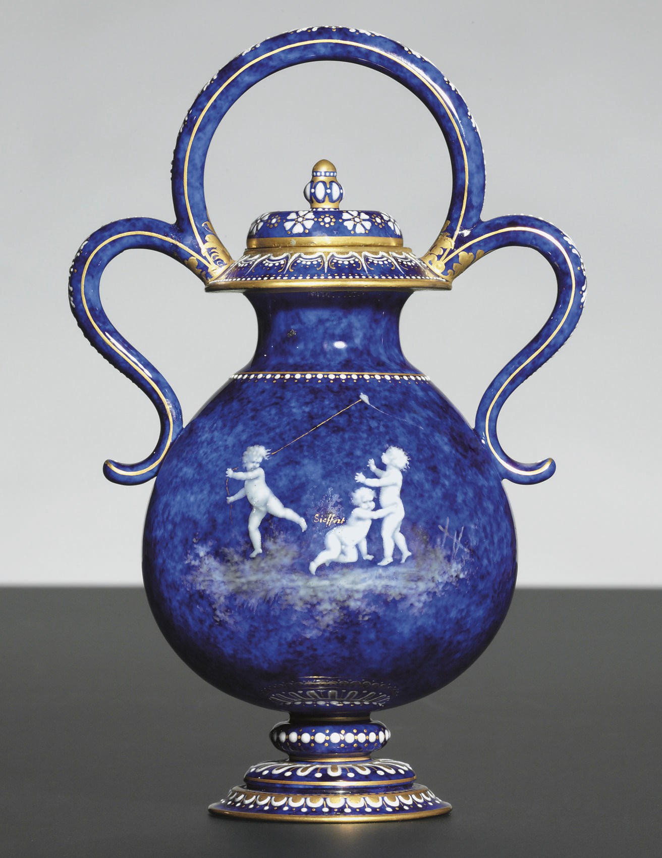 A SEVRES (THIRD REPUBLIC) ENAMELED BLEU LAPIS GROUND VASE AND COVER (VASE BIJOU A ANSES)