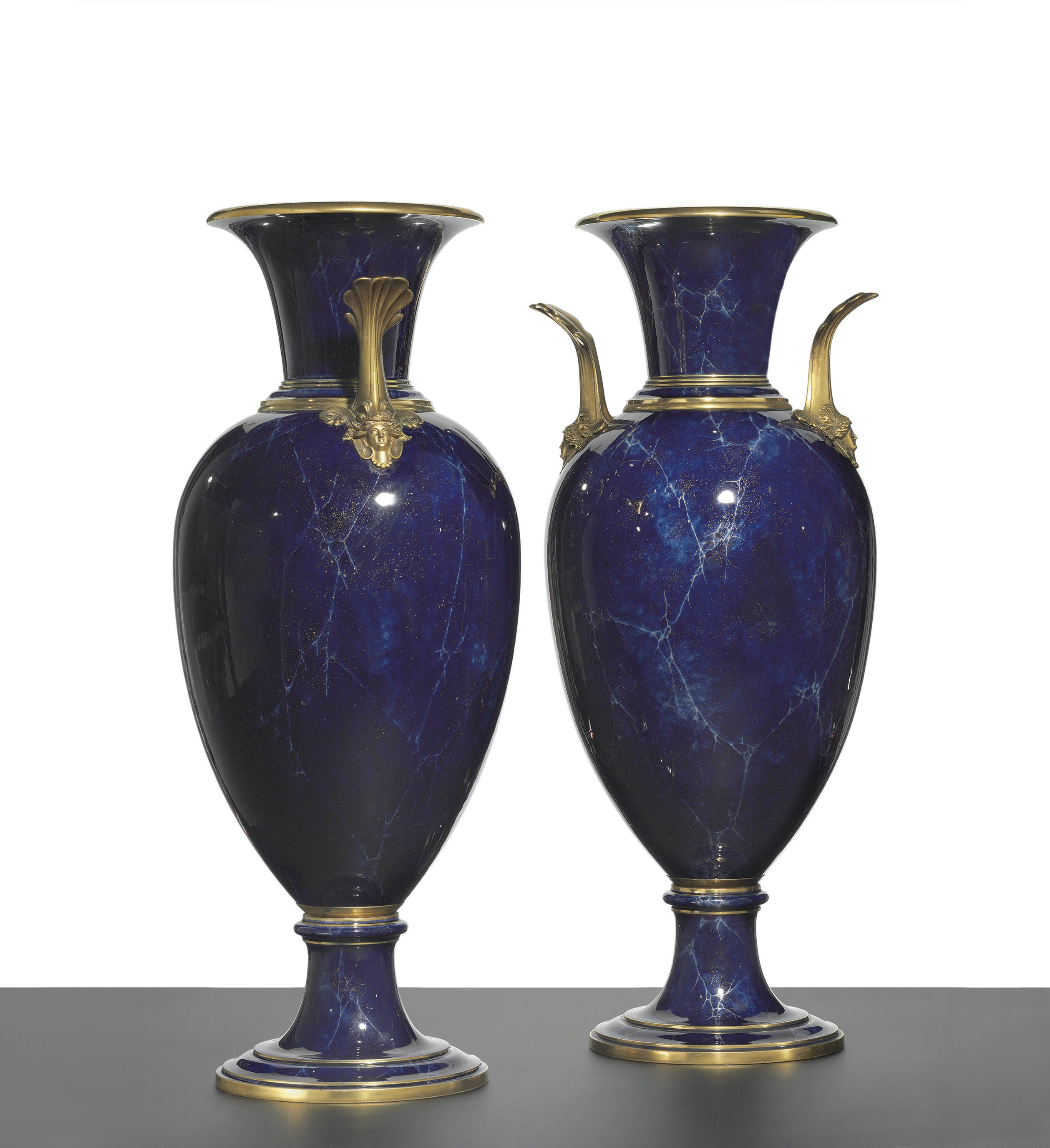 A PAIR OF ORMOLU-MOUNTED SEVRES (THIRD REPUBLIC) FAUX LAPIS GROUND VASES (VASES FORME OEUF)
