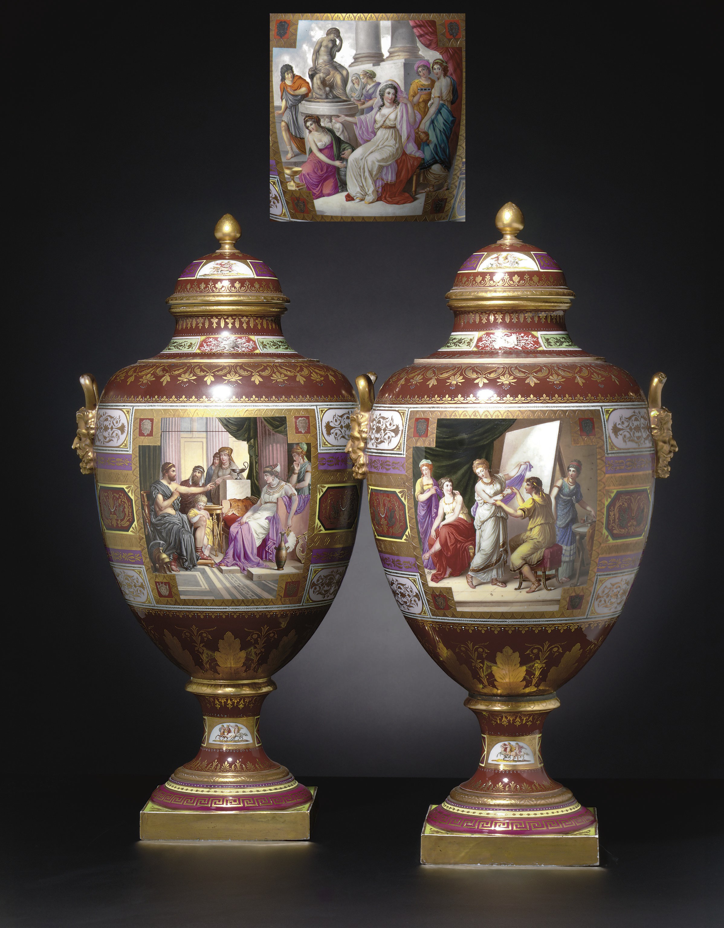 A PAIR OF VIENNA-STYLE BURGUNDY-GROUND VASES AND COVERS ON FIXED STANDS