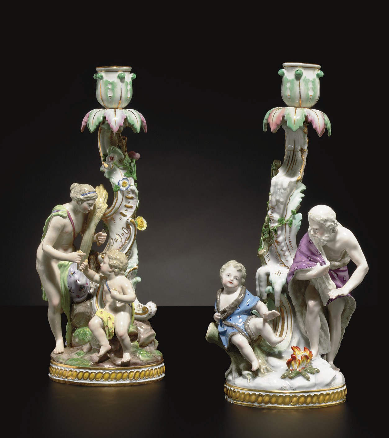 TWO MEISSEN CANDLESTICKS EMBLEMATIC OF SUMMER AND WINTER