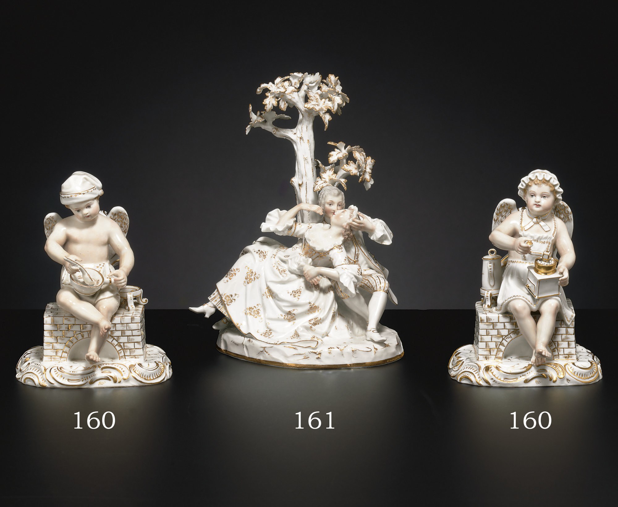 A PAIR OF MEISSEN GILT WHITE FIGURES OF A COOK AND COMPANION