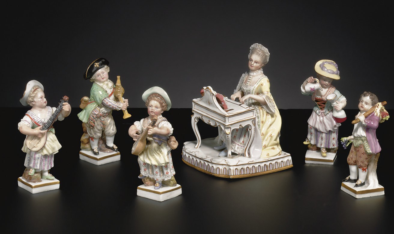 FIVE MEISSEN FIGURES ON SQUARE BASES AND A MEISSEN FIGURE EMBLEMATIC OF SOUND