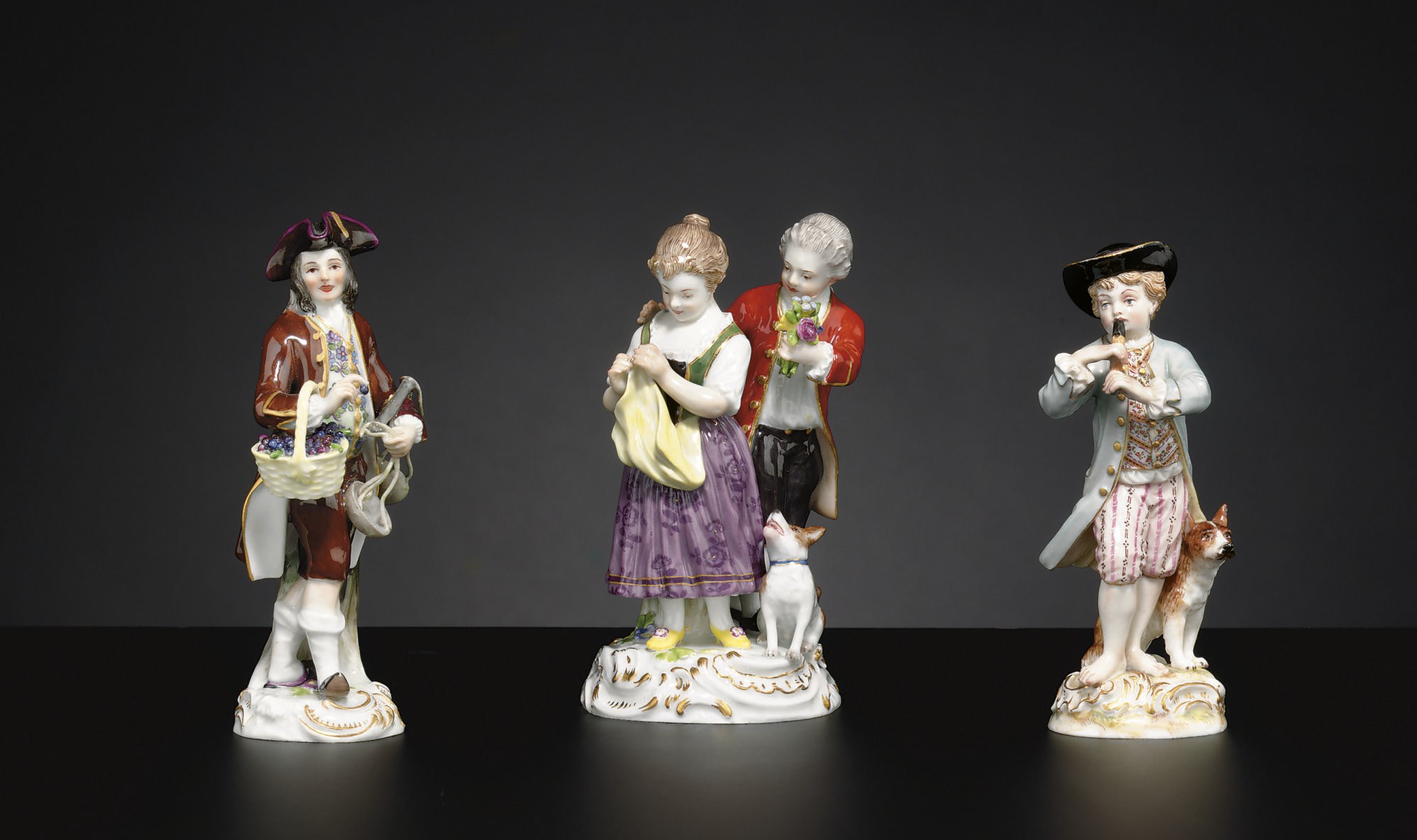 A MEISSEN FIGURE GROUP AND TWO MEISSEN FIGURES