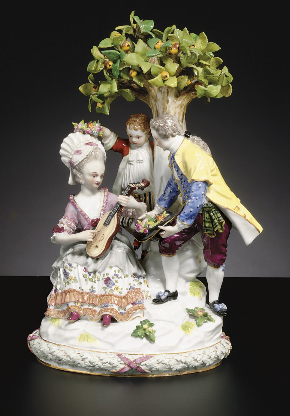 A MEISSEN 'UNDER THE TREE' PASTORAL FIGURE GROUP