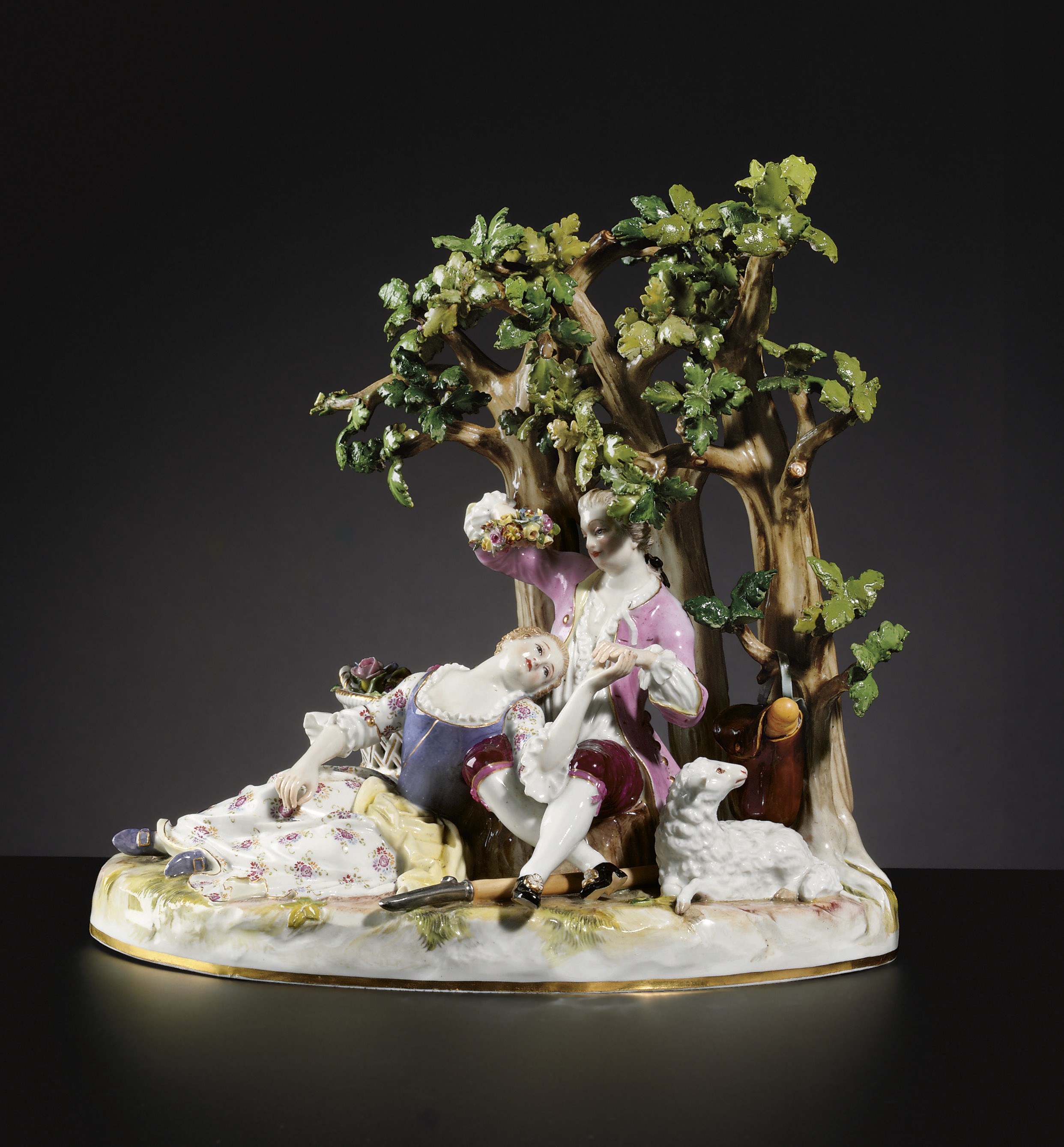 A MEISSEN PASTORAL GROUP OF A SHEPHERD AND SHEPHERDESS
