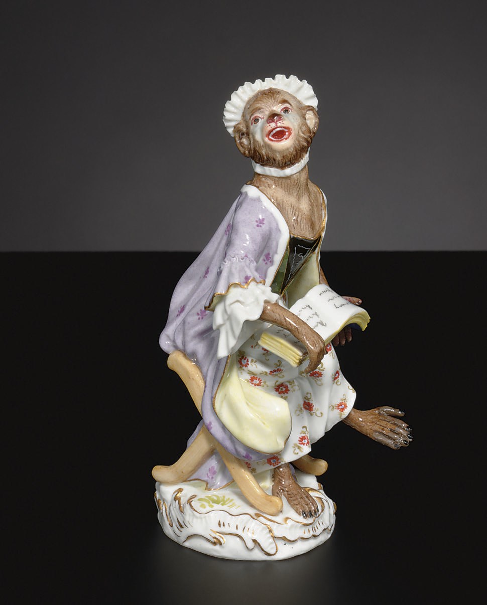 A MEISSEN MONKEY BAND, 'AFFENKAPELLE', MODEL OF A SONGSTRESS