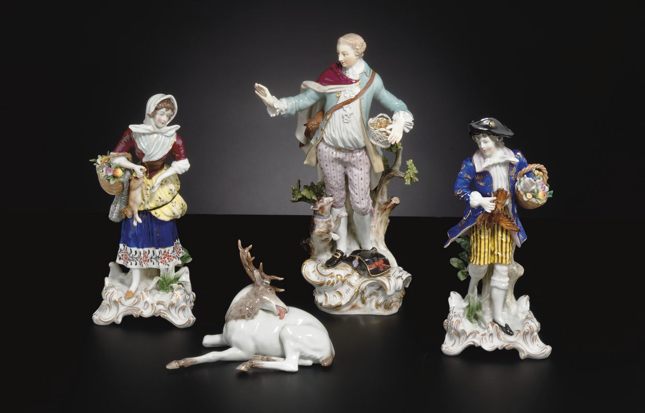 A MEISSEN FIGURE OF A GALLANT AND A MEISSEN MODEL OF A STAG