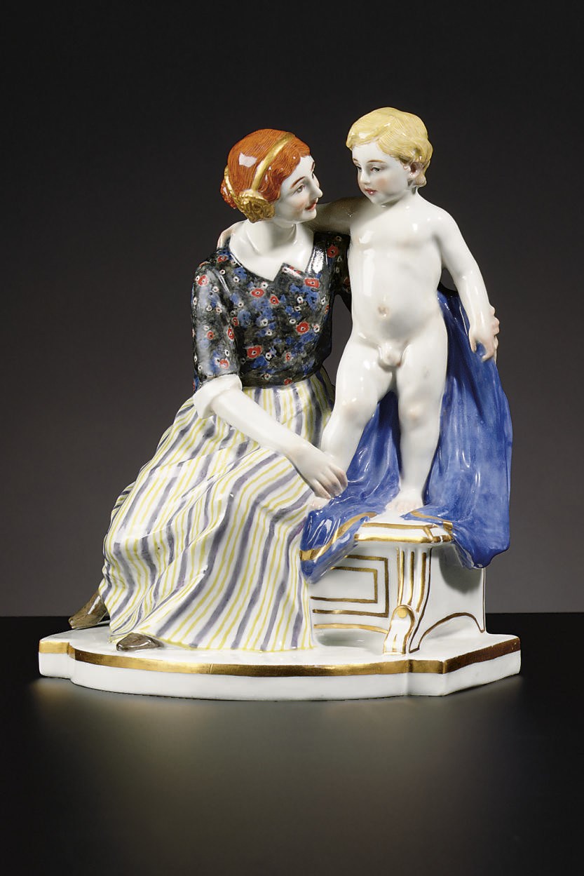 A MEISSEN FIGURE GROUP OF A MOTHER AND SON