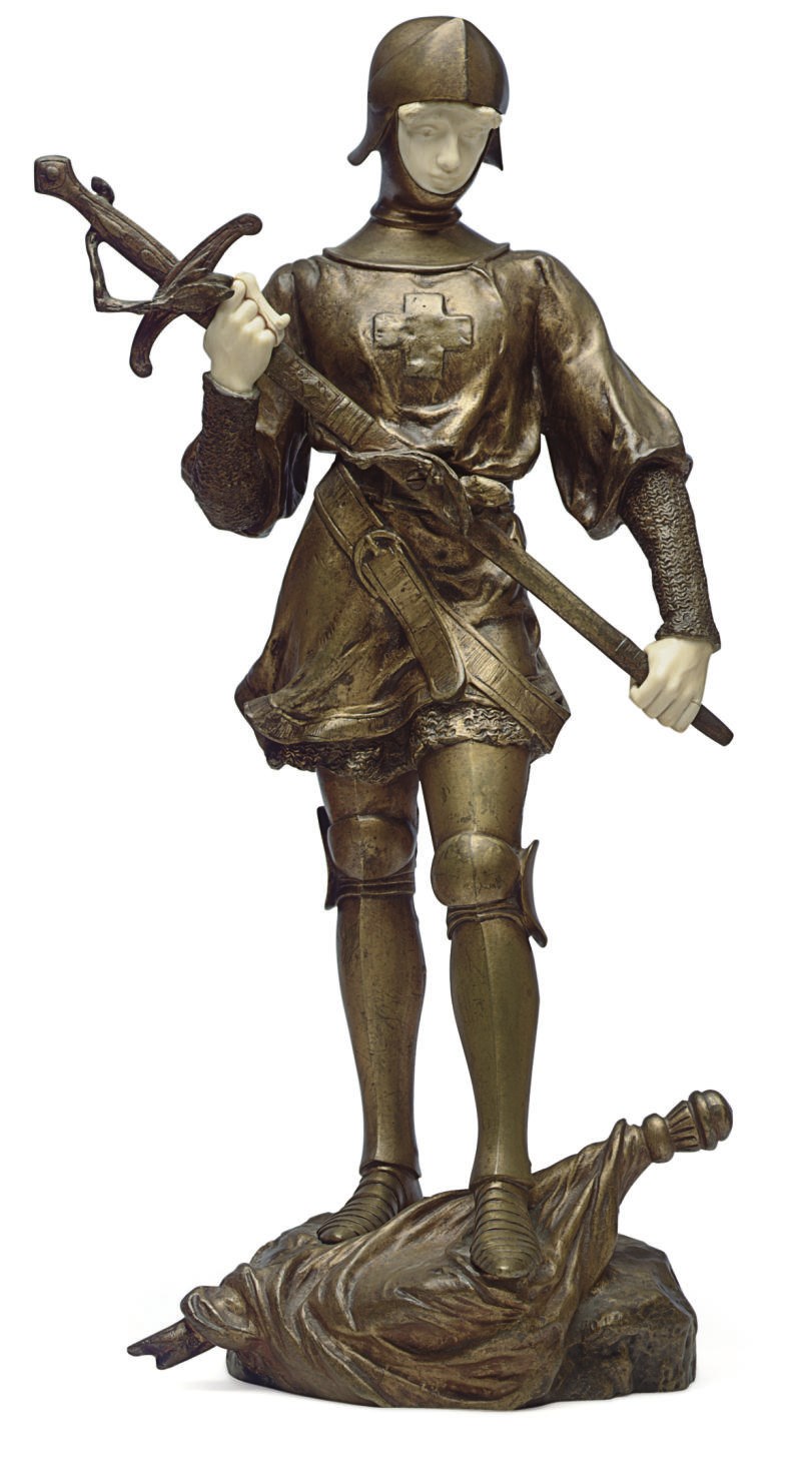 A FRENCH GILT-BRONZE AND IVORY FIGURE OF JEANNE D'ARC**