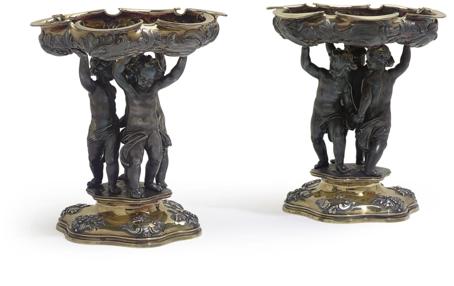 A pair of Victorian silver, silver-gilt and pewter figural tazze