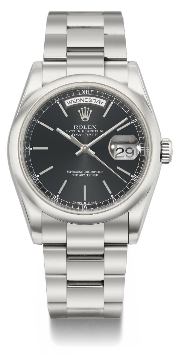 Rolex. An 18K white gold automatic calendar wristwatch with sweep centre seconds and bracelet