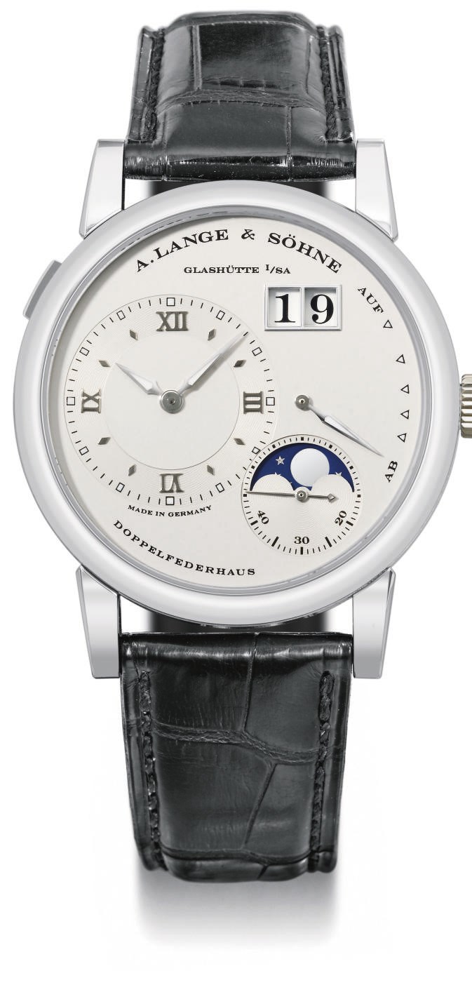 A. Lange & Söhne. A fine platinum twin barrel wristwatch with oversized date, power reserve and moon phases