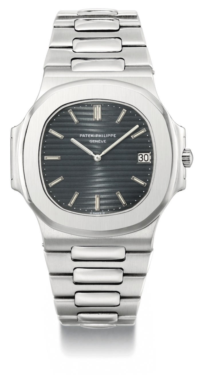 Patek Philippe. A fine and large stainless steel automatic wristwatch with date and bracelet