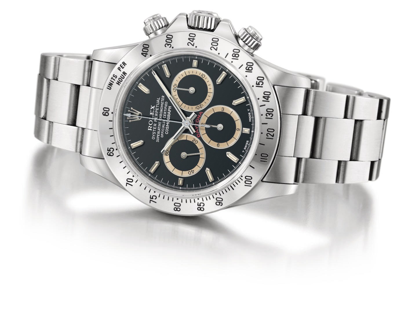 Rolex. A rare and attractive stainless steel automatic chronograph wristwatch with black dial, brown-coloured subsidiary dials, bracelet and box
