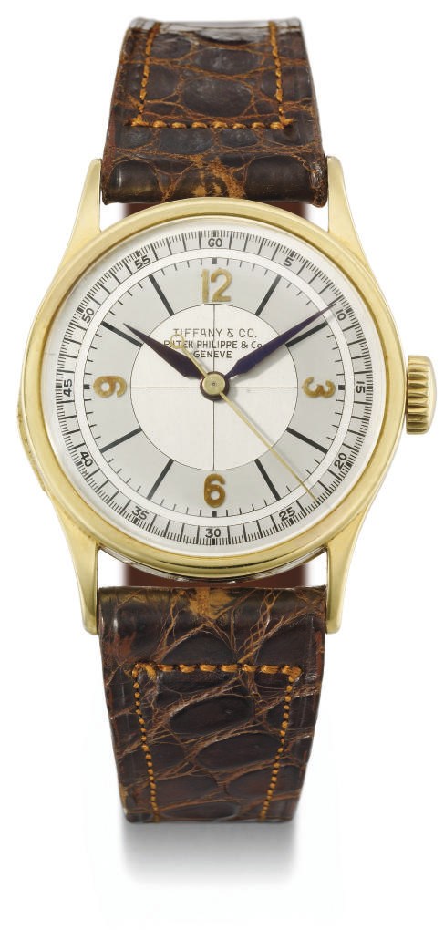 Patek Philippe, made for Tiffany & Co. A fine and rare 18K gold wristwatch with indirect sweep centre seconds and two-tone silvered sector dial