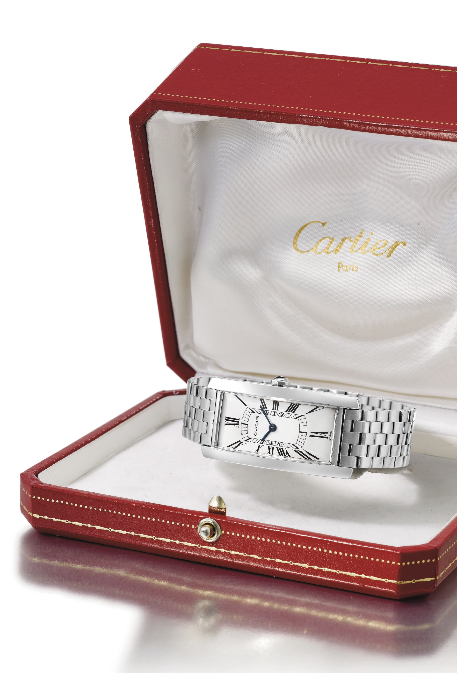 Cartier. A fine and large 18K white gold rectangular curved wristwatch with bracelet