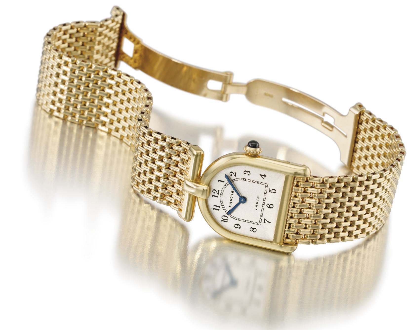 Cartier. An unusual 18K gold bell-shaped wristwatch with bracelet