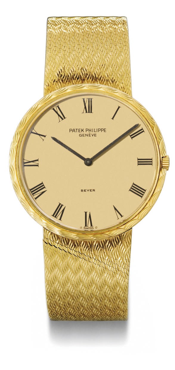 Patek Philippe. An 18K gold automatic wristwatch with bracelet