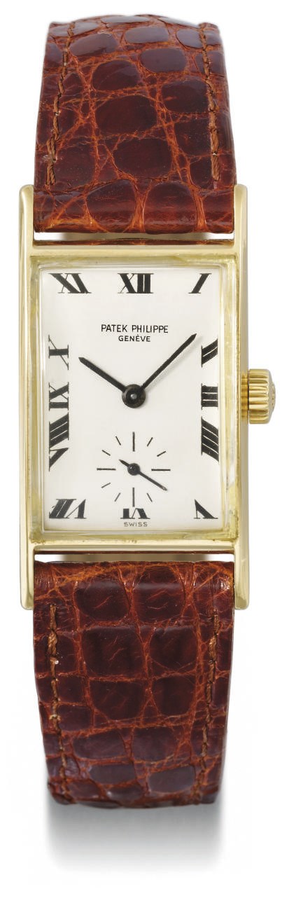 Patek Philippe. An 18K gold rectangular curved wristwatch