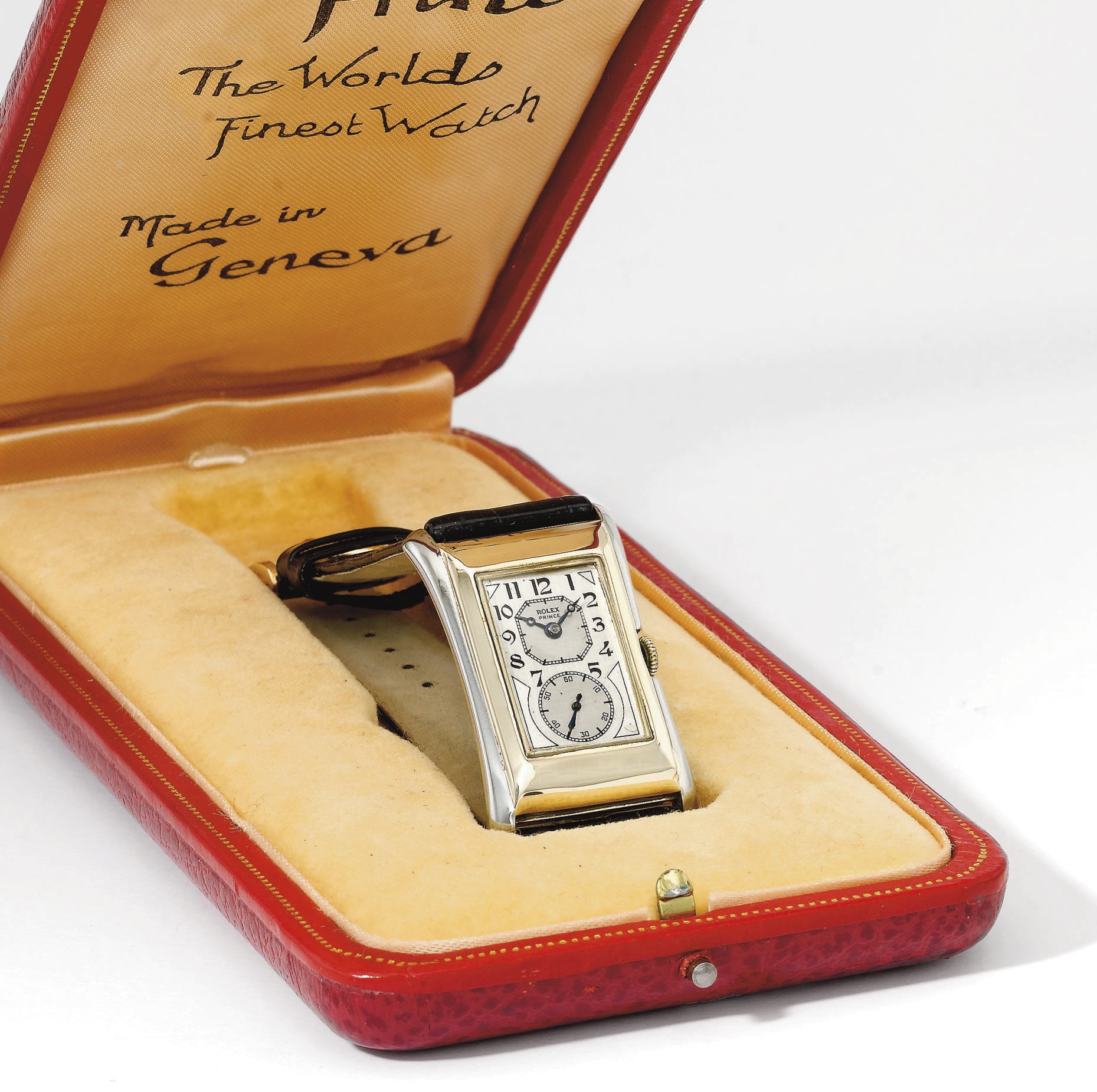 Rolex. A fine and rare 9K two colour gold rectangular doctor's wristwatch with two-tone silvered dial and original box