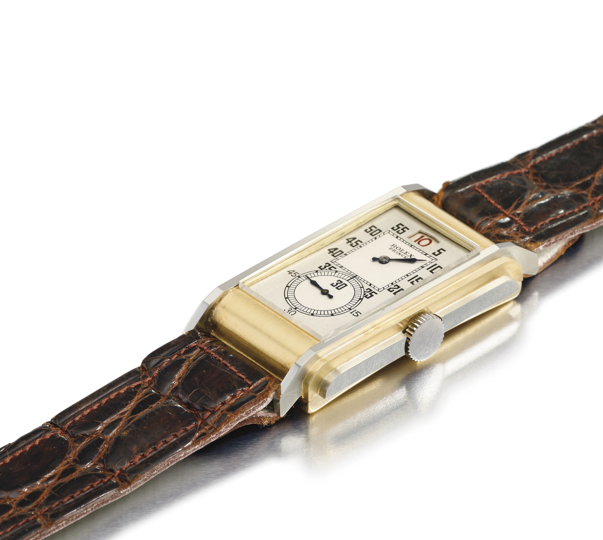 Rolex. A very fine and rare 18K white and yellow gold rectangular jump hour wristwatch with two-tone silvered dial