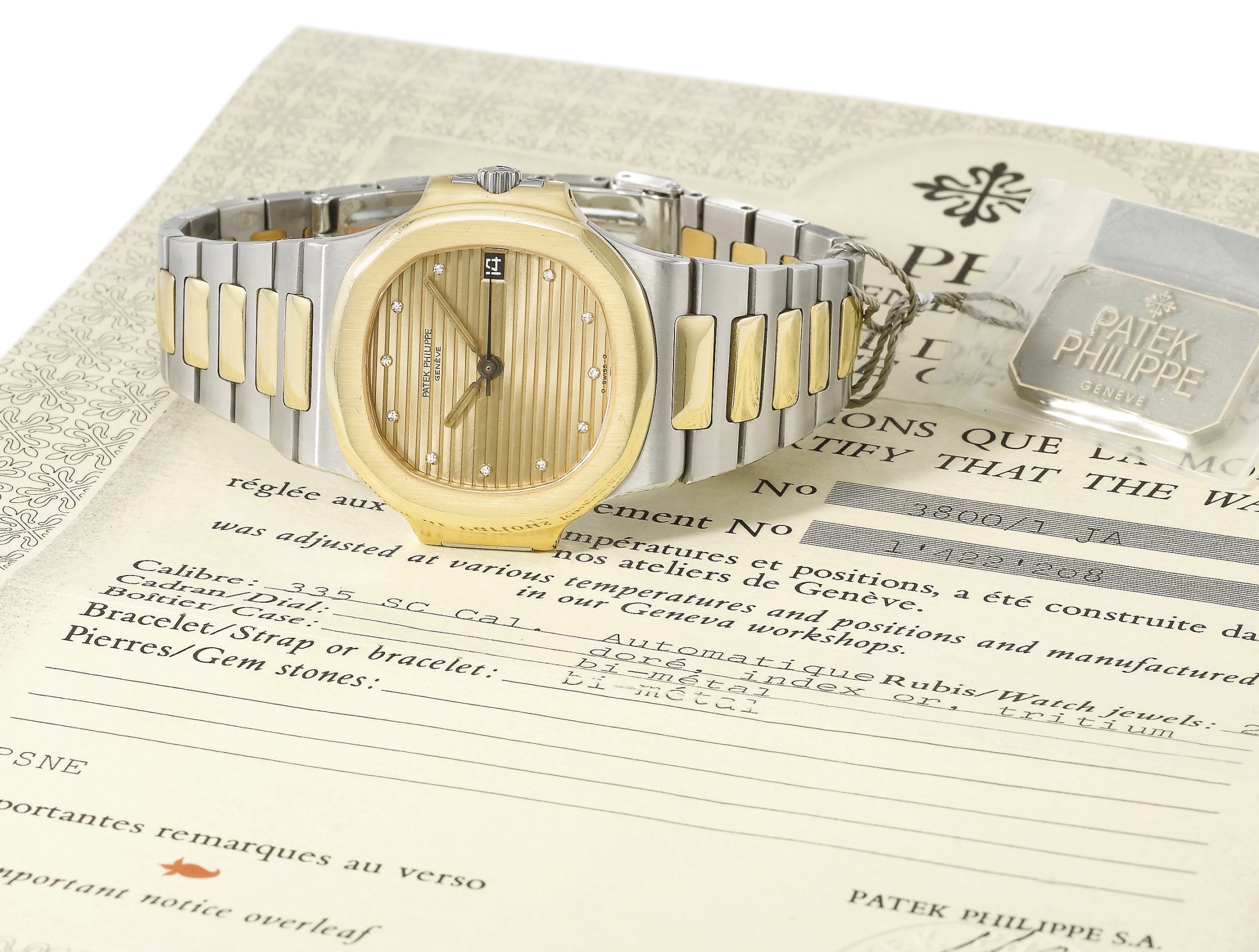 Patek Philippe. A stainless steel, gold and diamond-set automatic wristwatch with sweep centre seconds, date, bracelet, original sales tag, certificate and box