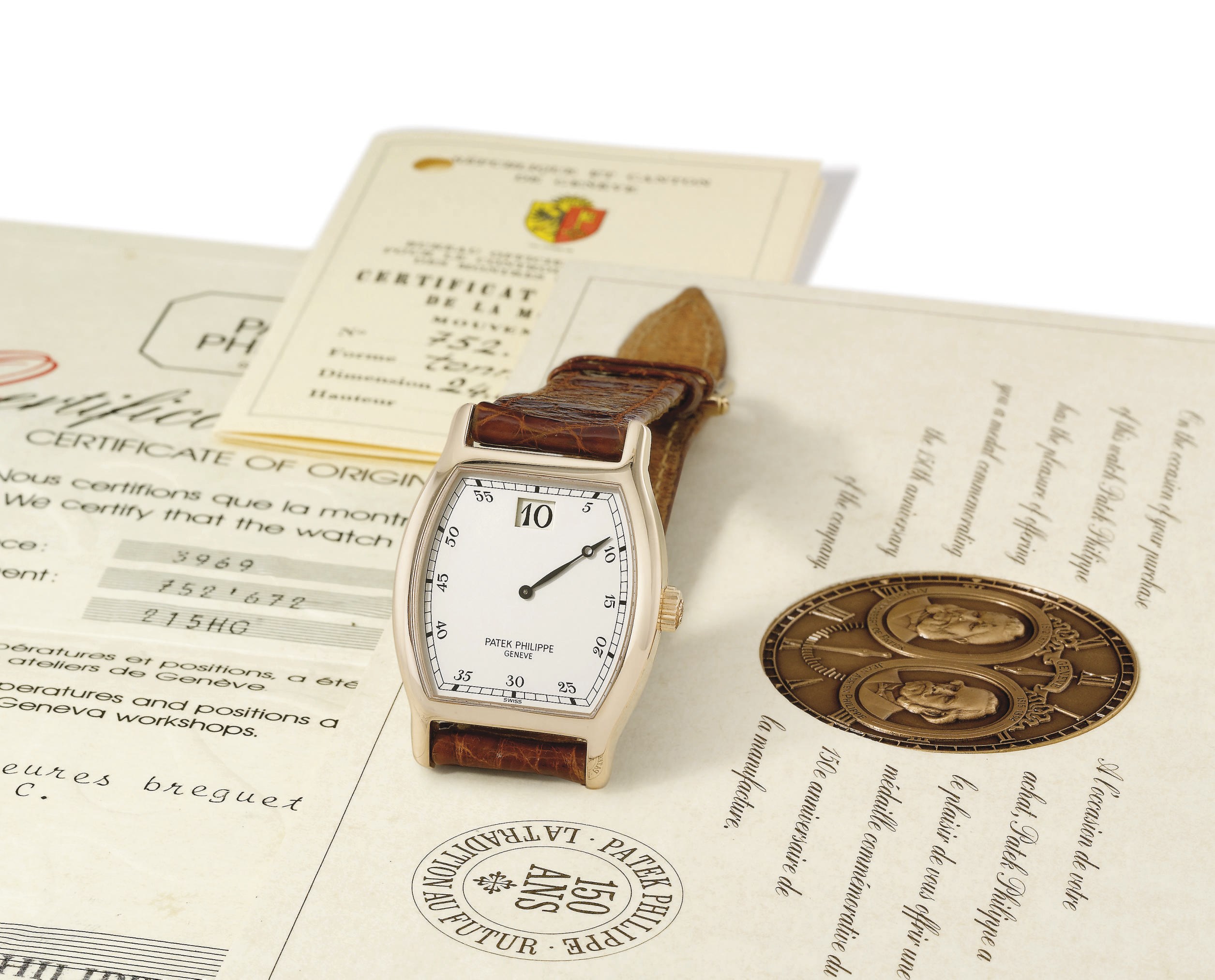 Patek Philippe. A fine and rare 18K pink gold limited edition tonneau-shaped jump hour wristwatch with original certificate, made for the company's 150th anniversary