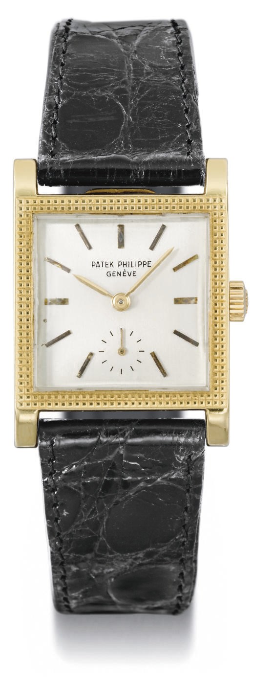 Patek Philippe. An 18K gold square wristwatch with later added case