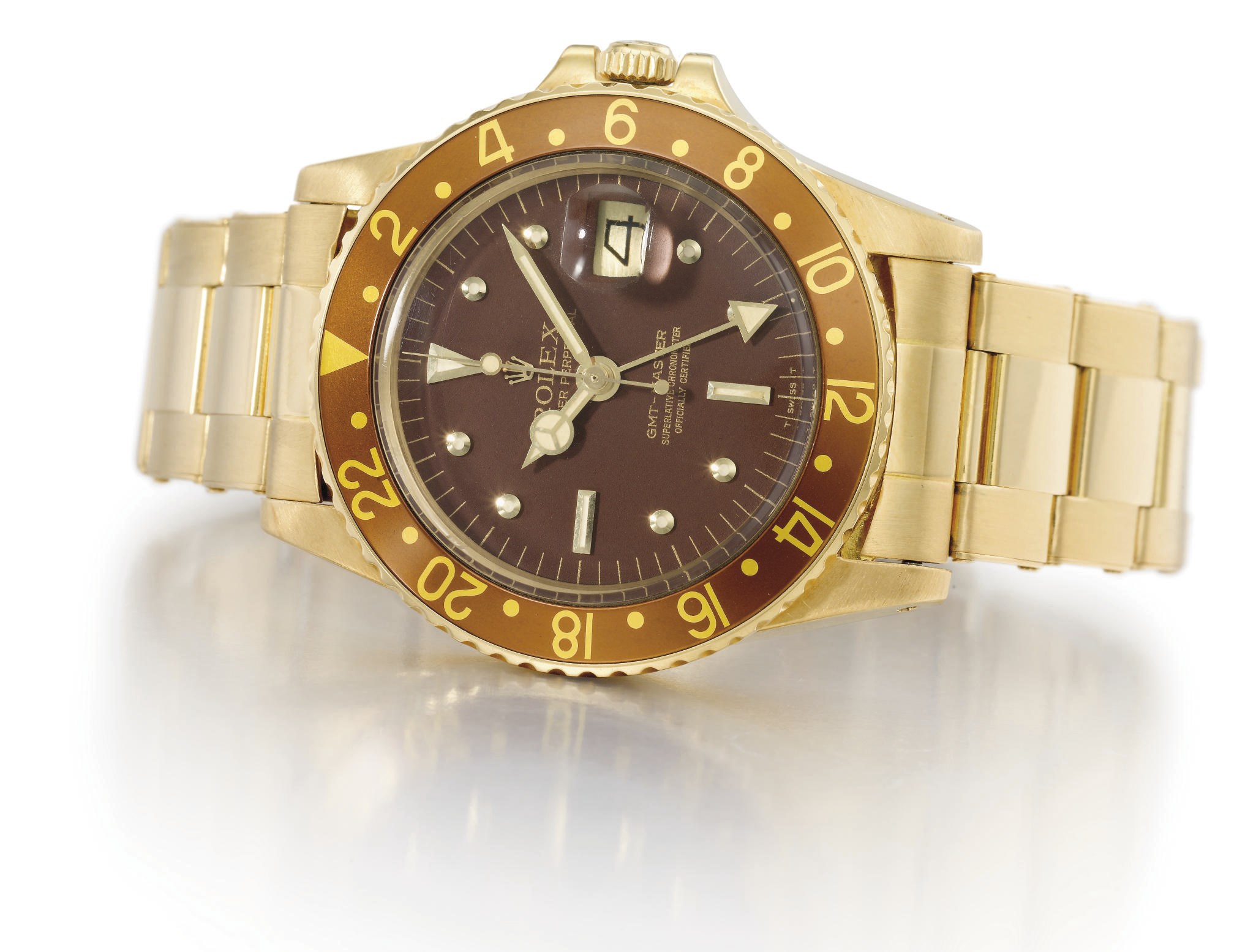 Rolex. A fine 18K gold automatic dual time wristwatch with sweep centre seconds, date, bracelet and box
