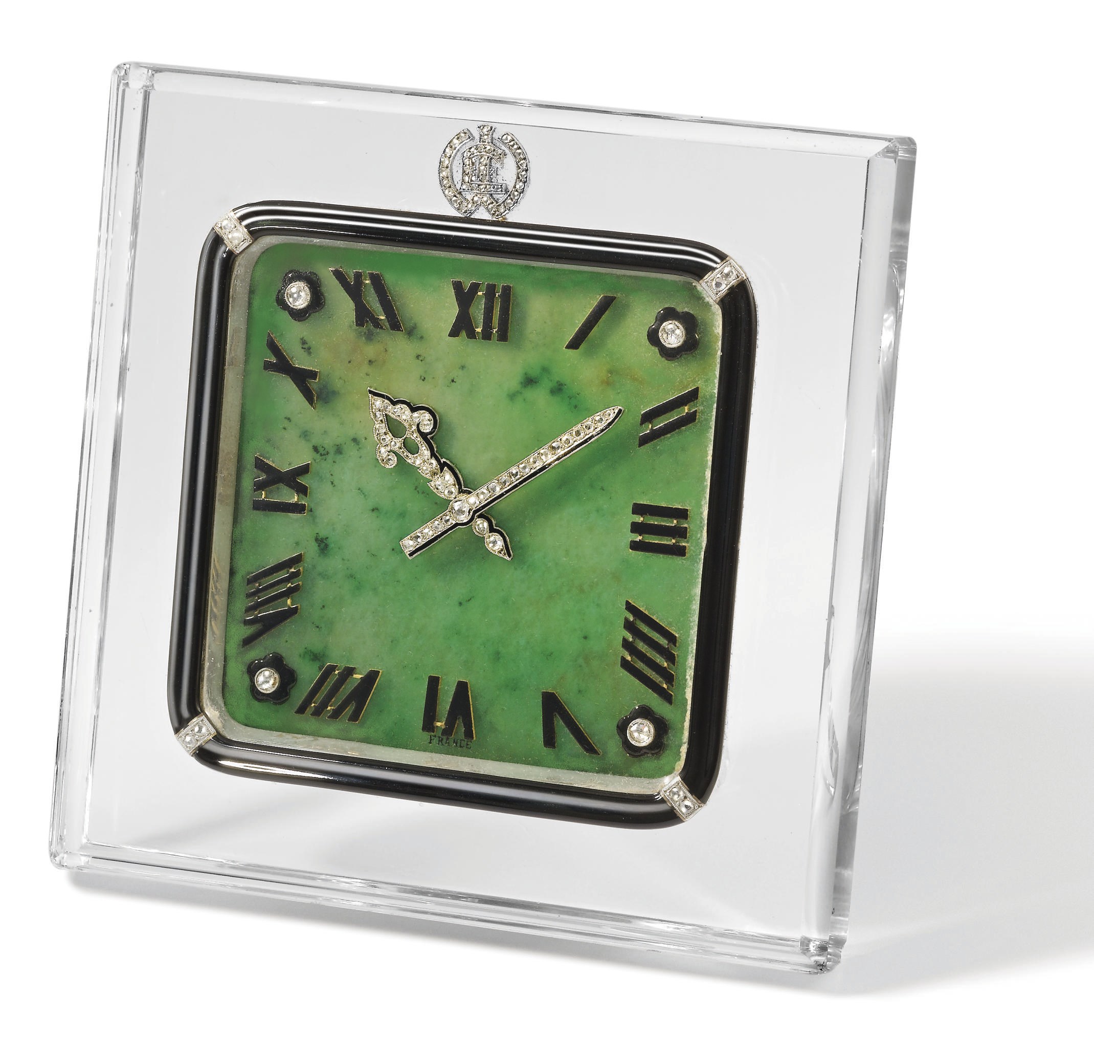 Cartier. An extremely fine and rare rock crystal, jade, enamel and diamond-set eight-day Art Deco desk clock