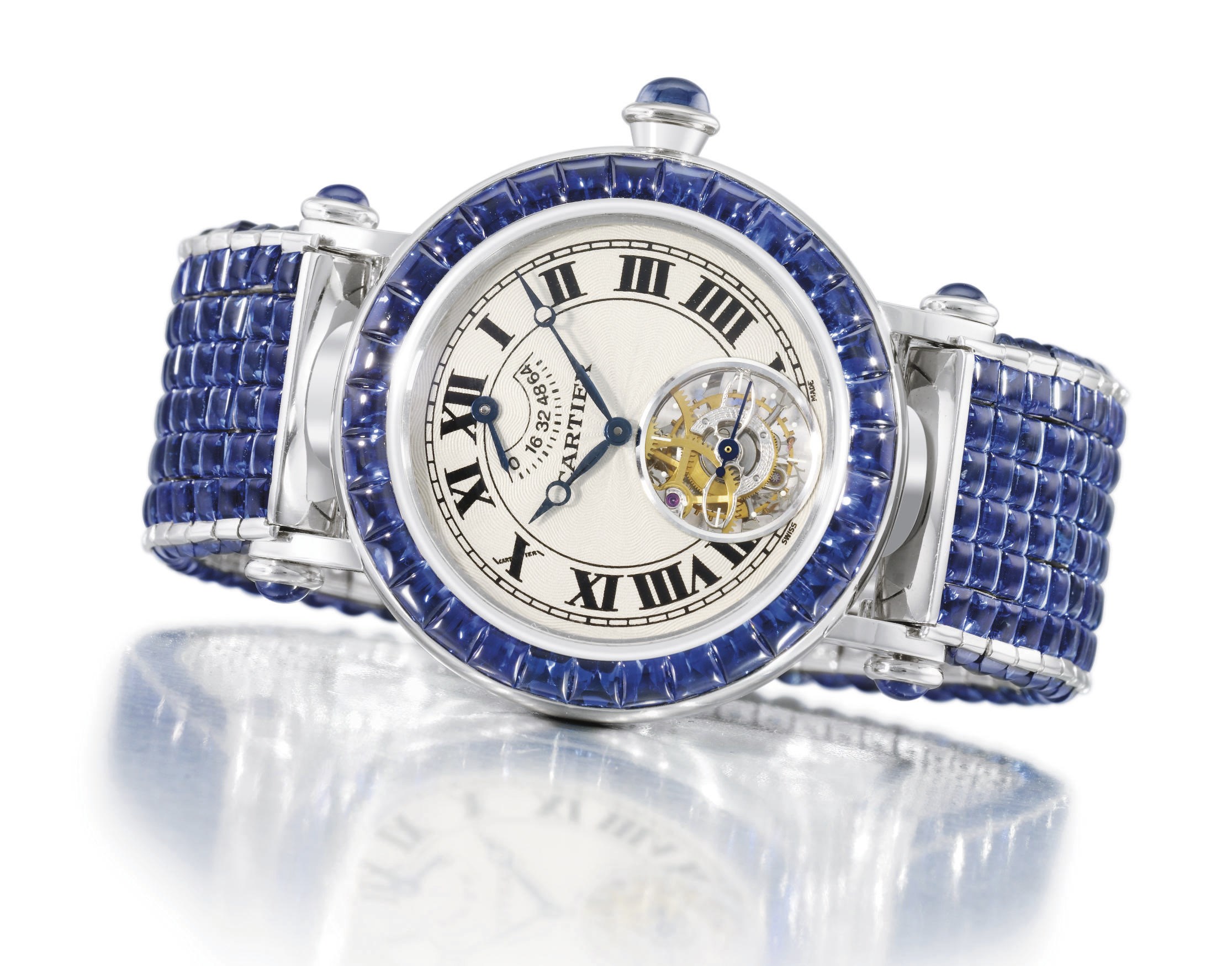 Cartier. An extremely fine and rare 18K white gold and sapphire-set automatic wristwatch with one minute tourbillon, power reserve and bracelet