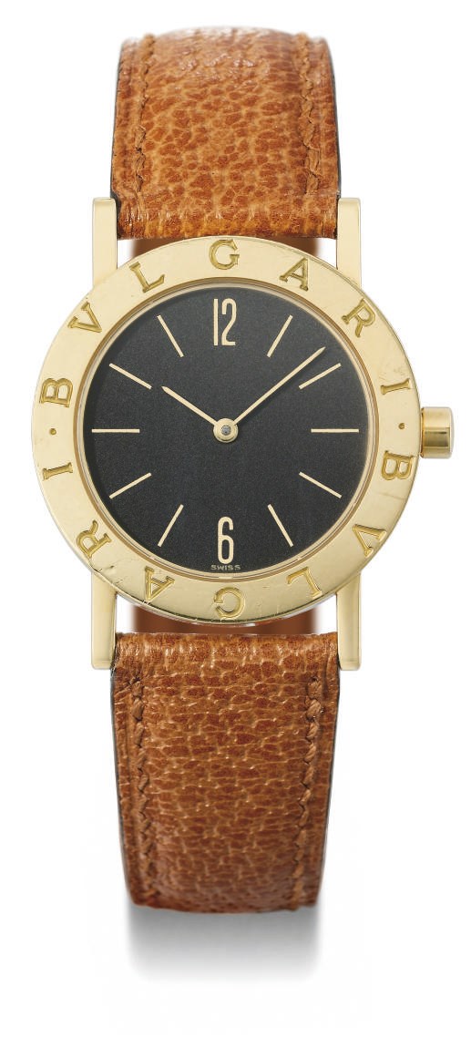 Bulgari. An 18K gold wristwatch with black dial