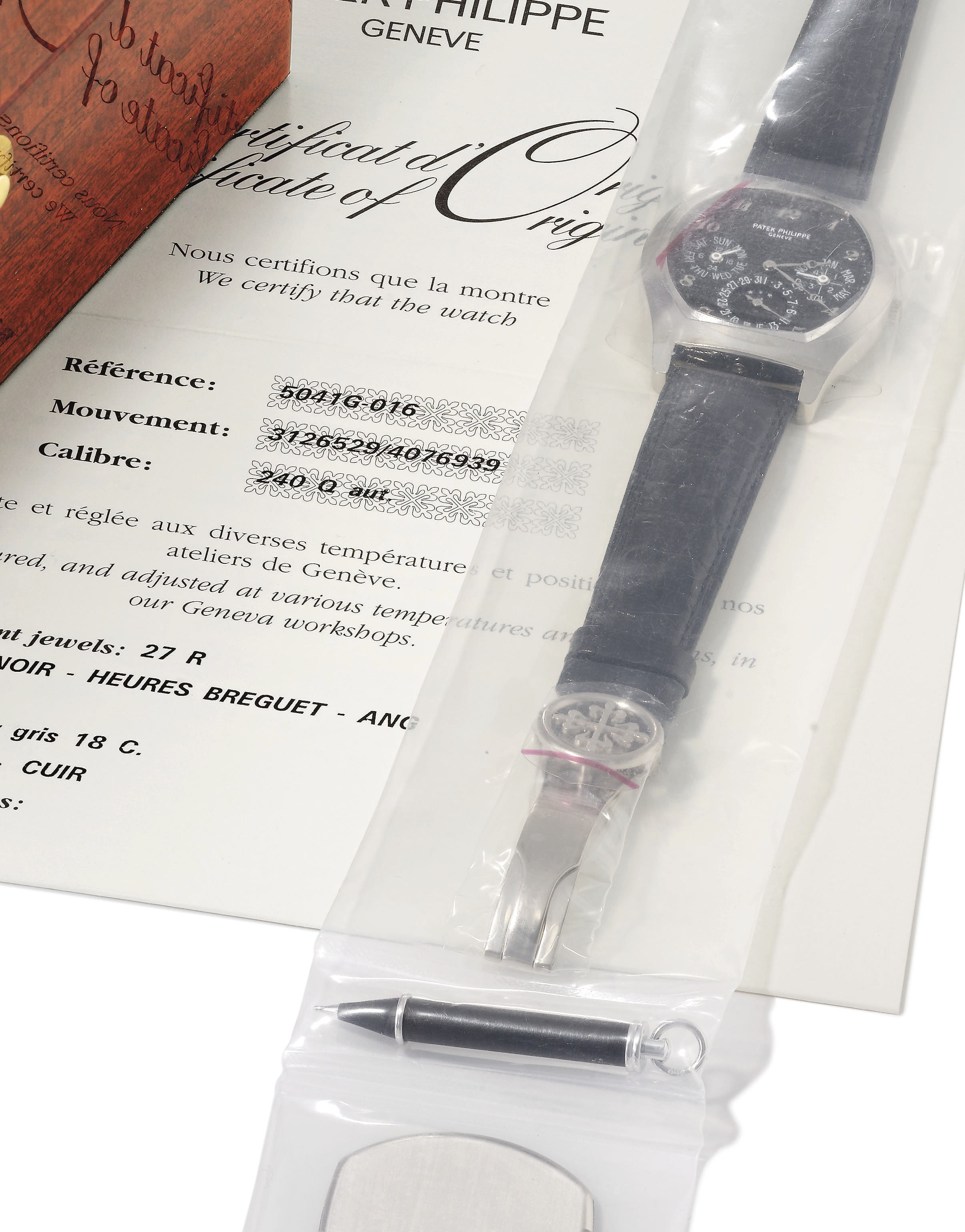 Patek Philippe. An extremely fine and rare 18K white gold automatic tonneau-shaped perpetual calendar wristwatch with moon phases, black dial, Breguet numerals and original certificate
