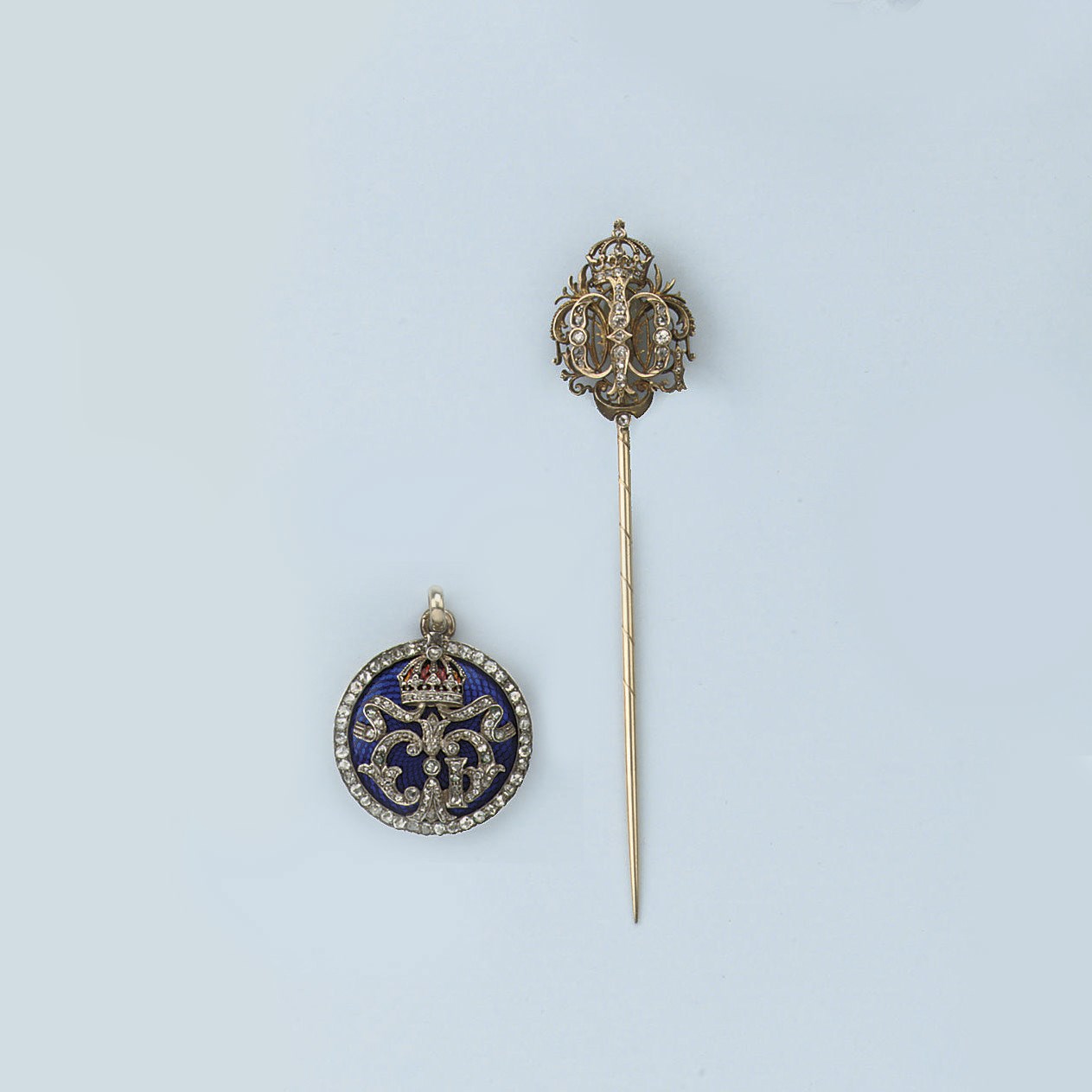 AN ENAMEL AND DIAMOND PENDANT AND A PIN