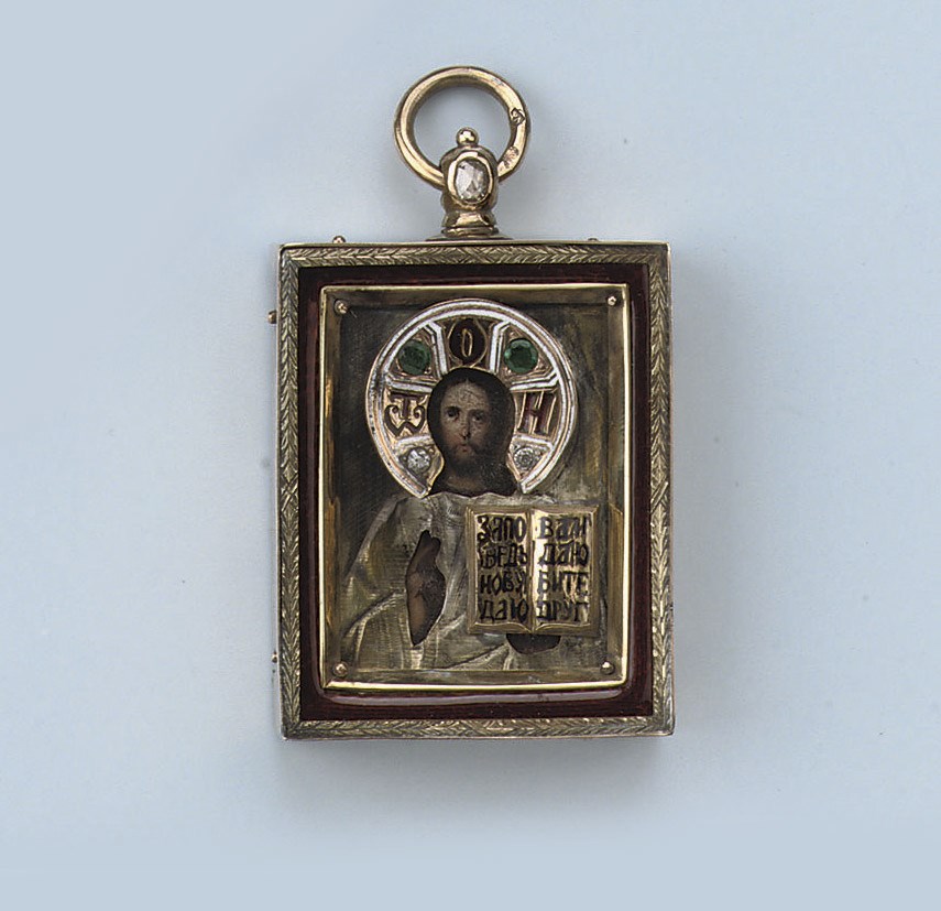 AN ENAMEL AND GEM SET ICON PENDANT