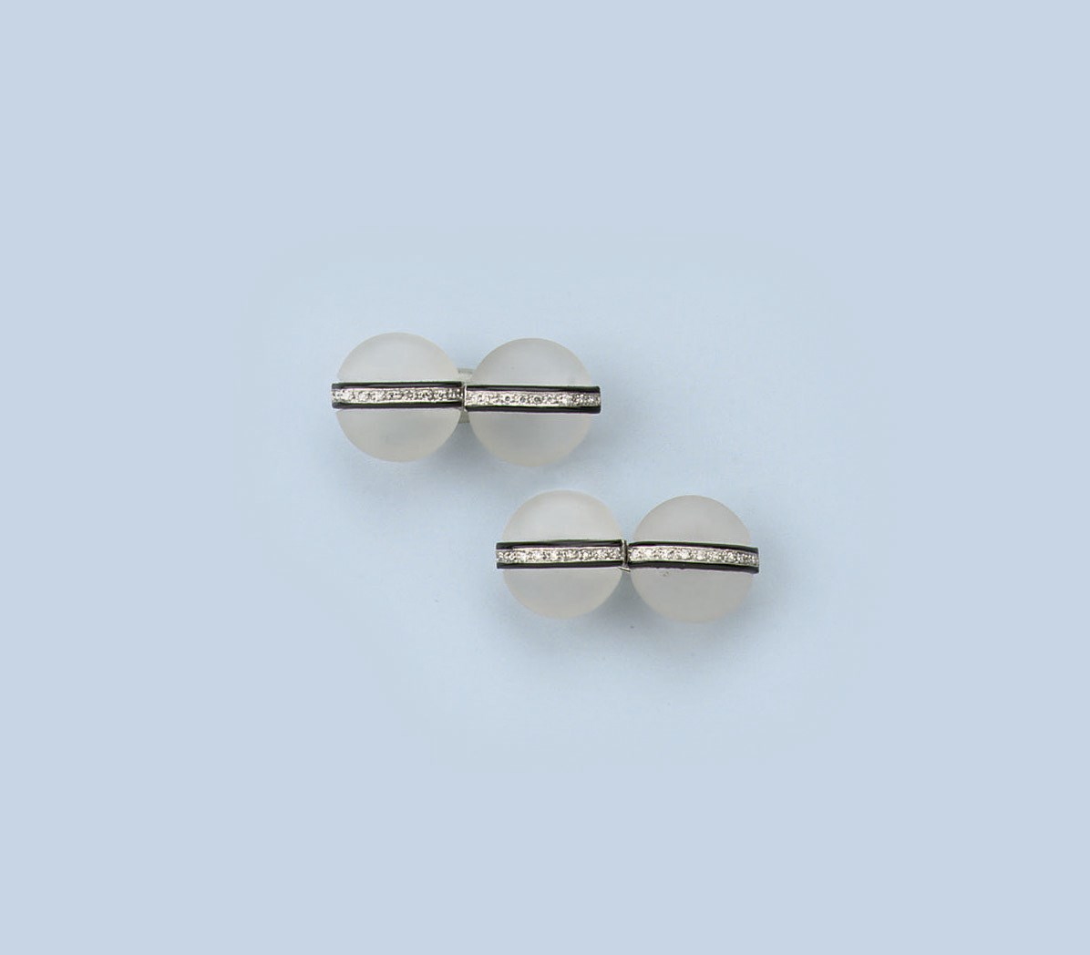 A PAIR OF ROCK CRYSTAL, ONYX AND DIAMOND CUFF LINKS